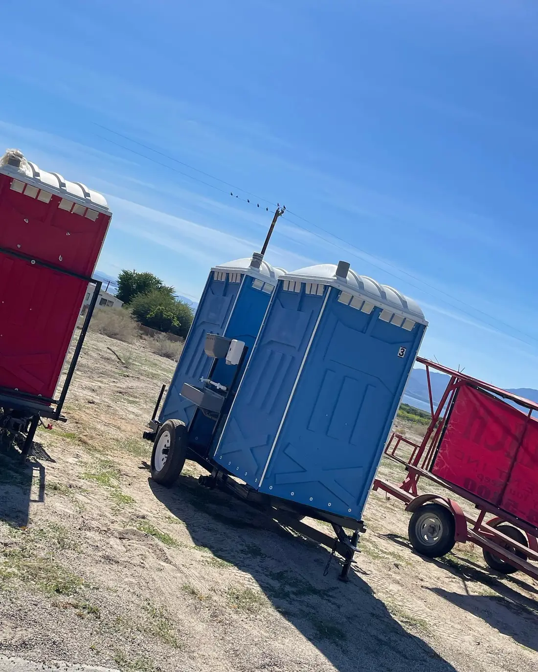Trailer-mounted porta potties for crews that move from Clean Sanitation Pros, available for delivery to Three Rivers, NM